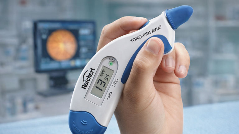 TonoPen handheld device measuring eye pressure during an eye exam