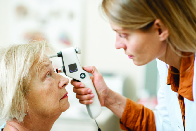 A patient having a post-operative exam after glaucoma surgery.