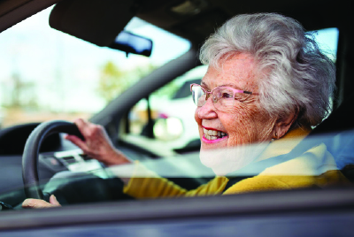 Image of an elderly woman driving