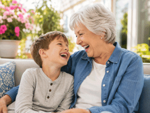 Senior woman laughing with her grandson at home, representing how glaucoma care can help protect vision for meaningful everyday moments at Wellish Abrams Vision Institute.