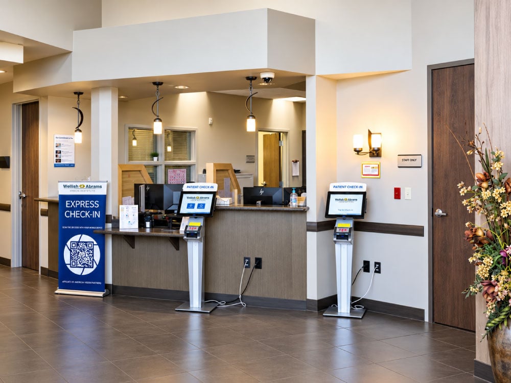 Wellish Abrams Vision Institute reception area with express patient check-in kiosks.
